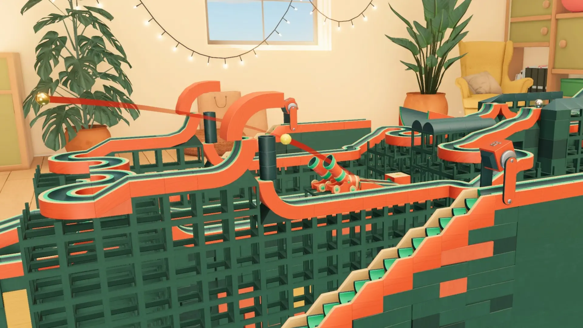 Cozy Marbles - una pista verde e arancione con dei cannoni che lanciano le biglie